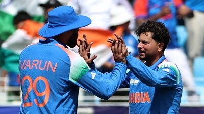 India's Kuldeep Yadav (R) celebrates with teammate Varun Chakravarthy after taking the wicket of New Zealand's Rachin Ravindra during the ICC Champions Trophy one-day international (ODI) final cricket match between India and New Zealand. (AFP) India's Kuldeep Yadav (R) celebrates with teammate Varun Chakravarthy after taking the wicket of New Zealand's Rachin Ravindra during the ICC Champions Trophy one-day international (ODI) final cricket match between India and New Zealand. (AFP)