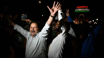 Champions Trophy 2025: Fans celebrate near India Gate in New Delhi after India won the ICC Champions Trophy one-day international (ODI) final cricket match against New Zealand in Dubai. (AFP) Champions Trophy 2025: Fans celebrate near India Gate in New Delhi after India won the ICC Champions Trophy one-day international (ODI) final cricket match against New Zealand in Dubai. (AFP)