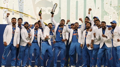 Team India players celebrate after winning the Champions Trophy title, defeating New Zealand by 4 wickets in the final on Sunday. (AP) Team India players celebrate after winning the Champions Trophy title, defeating New Zealand by 4 wickets in the final on Sunday. (AP)