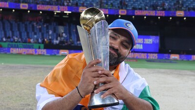 Rohit Sharma poses with the Champions Trophy after India beat New Zealand to win the title (AP) Rohit Sharma poses with the Champions Trophy after India beat New Zealand to win the title (AP)