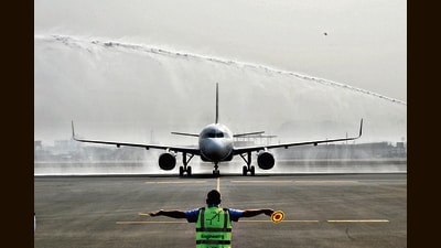 First commercial aircraft landing on the runway of Navi Mumbai International Airport Ltd at Ulwe in Navi Mumbai. (HT Photo)
