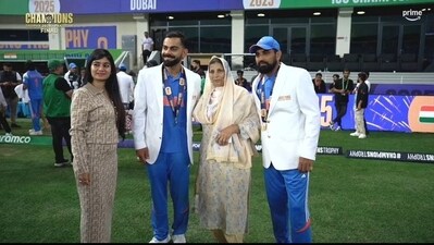 Virat Kohli takes a picture with Mohammed Shami and his family. (Broadcast)