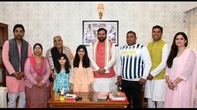 Haryana chief minister Nayab Singh Saini with Santram Deswal’s family in Chandigarh on Sunday. (Sourced)