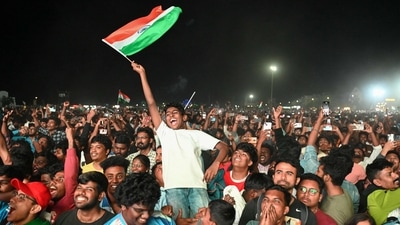 A fan waves the national flag of India as fans celebrate India's victory in the ICC Champions Trophy one-day international (ODI) final cricket match between India and New Zealand, at a live screening of the match at Elliot's beach in Chennai. (AFP) A fan waves the national flag of India as fans celebrate India's victory in the ICC Champions Trophy one-day international (ODI) final cricket match between India and New Zealand, at a live screening of the match at Elliot's beach in Chennai. (AFP)