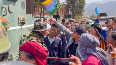 Kuki protesters during a road blockade on day one of their Manipur Free Movement, Kangpokpi district on Saturday. (PTI) Kuki protesters during a road blockade on day one of their Manipur Free Movement, Kangpokpi district on Saturday. (PTI)