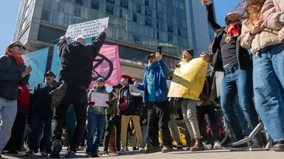 NEW YORK, NEW YORK - MARCH 08: Protesters gather outside of a Manhattan Tesla dealership to demonstrate against Tesla CEO Elon Musk on March 08, 2025, in New York City. (AFP) NEW YORK, NEW YORK - MARCH 08: Protesters gather outside of a Manhattan Tesla dealership to demonstrate against Tesla CEO Elon Musk on March 08, 2025, in New York City. (AFP)
