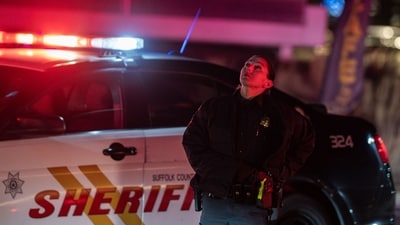A sheriff looks up at a passing helicopter near Francis S. Gabreski Airport on March 8, 2025 in Westhampton, New York. Amid the ongoing efforts to douse fires, one firefighter has been taken to a hospital after suffering second-degree facial burns, according to Suffolk County executive Ed Romaine. There have been no reports of additional injuries. (Photo by David Dee Delgado / GETTY IMAGES NORTH AMERICA / Getty Images via AFP) (Getty Images via AFP) A sheriff looks up at a passing helicopter near Francis S. Gabreski Airport on March 8, 2025 in Westhampton, New York. Amid the ongoing efforts to douse fires, one firefighter has been taken to a hospital after suffering second-degree facial burns, according to Suffolk County executive Ed Romaine. There have been no reports of additional injuries. (Photo by David Dee Delgado / GETTY IMAGES NORTH AMERICA / Getty Images via AFP) (Getty Images via AFP)