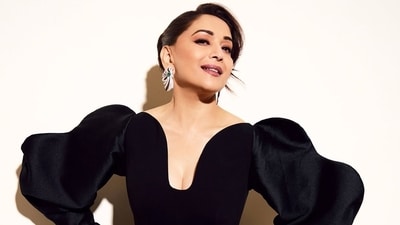 Madhuri Dixit dazzles in a black gown and glittering jewels. Madhuri Dixit dazzles in a black gown and glittering jewels.