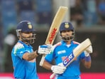 India's Virat Kohli celebrates his half century.