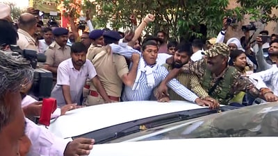 Enforcement Directorate (ED) personnel being stopped as they leave after searching the residence of former Chief Minister and Congress leader Bhupesh Baghel in an ongoing money laundering case, in Durg on Monday. (ANI) Enforcement Directorate (ED) personnel being stopped as they leave after searching the residence of former Chief Minister and Congress leader Bhupesh Baghel in an ongoing money laundering case, in Durg on Monday. (ANI)