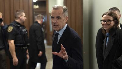 Canada Liberal leader Mark Carney speaks briefly with media before making his way to caucus meeting in Ottawa, on Monday. (AP) Canada Liberal leader Mark Carney speaks briefly with media before making his way to caucus meeting in Ottawa, on Monday. (AP)