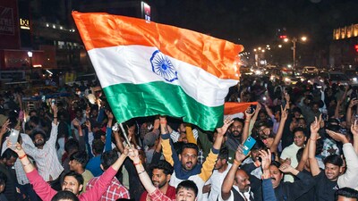 Cricket fans celebrate India's victory over New Zealand in the ICC Champions Trophy 2025 final match in Uttar Pradesh. (ANI) Cricket fans celebrate India's victory over New Zealand in the ICC Champions Trophy 2025 final match in Uttar Pradesh. (ANI)