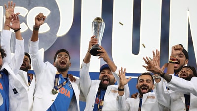 Team India celebrate with the trophy, led by skipper Rohit Sharma. (AP)