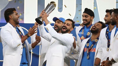India's Virat Kohli and teammates celebrate with the winners trophy on the podium after defeating New Zealand in the final cricket match of the ICC Champions Trophy at Dubai International Cricket Stadium in Dubai, United Arab Emirates, Sunday, March 9, 2025. (AP Photo/Christopher Pike) (AP) India's Virat Kohli and teammates celebrate with the winners trophy on the podium after defeating New Zealand in the final cricket match of the ICC Champions Trophy at Dubai International Cricket Stadium in Dubai, United Arab Emirates, Sunday, March 9, 2025. (AP Photo/Christopher Pike) (AP)