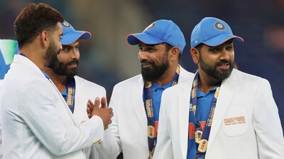 India's captain Rohit Sharma, Mohammed Shami, Ravindra Jadeja, Virat Kohli react after receiving the white coats during the presentation ceremony. (AP)