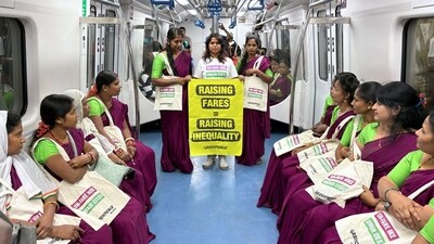 Commuters in metro train of Bengaluru protesting against fare hike. Commuters in metro train of Bengaluru protesting against fare hike.