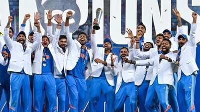 India's players celebrate with the trophy after winning the ICC Champions Trophy final against New Zealand in Dubai (HT_PRINT)