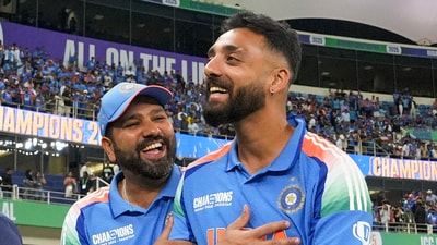 Rohit Sharma celebrates with spinner Varun Chakaravarthy, who was India's X-factor in the tournament. (PTI)