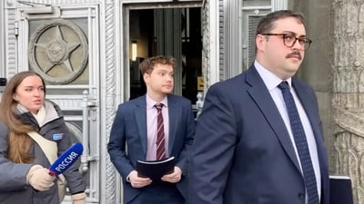 Representatives of the British embassy exit the main building of the Russian Foreign Ministry in Moscow, Russia, after a decision to revoke the accreditations of two British diplomats who had provided false personal information while seeking permission to enter Russia. (AP) Representatives of the British embassy exit the main building of the Russian Foreign Ministry in Moscow, Russia, after a decision to revoke the accreditations of two British diplomats who had provided false personal information while seeking permission to enter Russia. (AP)
