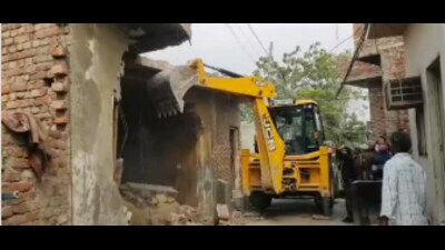 The demolition followed an investigation and the completion of property measurements by the revenue department in the presence of the police. (HT Photo) The demolition followed an investigation and the completion of property measurements by the revenue department in the presence of the police. (HT Photo)