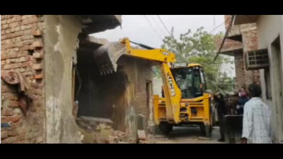 The demolition followed an investigation and the completion of property measurements by the revenue department in the presence of the police. (HT Photo)