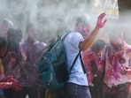 Students play with colours outside their school in New Delhi ahead of the upcoming festival of Holi. Students play with colours outside their school in New Delhi ahead of the upcoming festival of Holi.