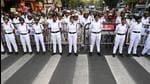Police personnel stand guard amid a protest rally against TMC and the Left at Jadavpur University campus in Kolkata. (Samir Jana/ HT Photo)
