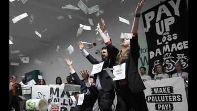 Activists participate in a demonstration for climate finance at the COP29 UN Climate Summit, in Baku, Azerbaijan, on Nov 21, 2024. (AP)