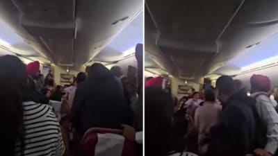 A viral video shows passengers arguing inside a plane. (X/@dom_lucre) A viral video shows passengers arguing inside a plane. (X/@dom_lucre)