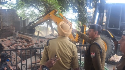 Police overseeing the demolition of an illegal structure built by a drug peddler in Sunam town of Sangrur district on Tuesday. (HT Photo)