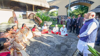 Prime Minister Narendra Modi receives a warm welcome from the members of the Indian diaspora as he arrives at a hotel, in Port Louis on Tuesday. (DPR PMO/ANI) Prime Minister Narendra Modi receives a warm welcome from the members of the Indian diaspora as he arrives at a hotel, in Port Louis on Tuesday. (DPR PMO/ANI)