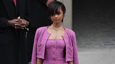 Tyla arrives at Chanel’s Womenswear presentation in a stunning all-pink ensemble, featuring a chic mini dress, a cropped jacket, and a statement Chanel necklace. (AFP) Tyla arrives at Chanel’s Womenswear presentation in a stunning all-pink ensemble, featuring a chic mini dress, a cropped jacket, and a statement Chanel necklace. (AFP)