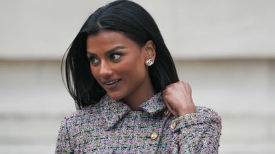 Simone Ashley stuns in Chanel, wearing a multicoloured plaid jacket and a mini skirt, perfectly paired with elegant diamond stud earrings. (AFP) Simone Ashley stuns in Chanel, wearing a multicoloured plaid jacket and a mini skirt, perfectly paired with elegant diamond stud earrings. (AFP)