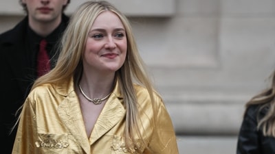 Dakota Fanning arrived at Chanel Fall/Winter 2025-2026 collection at Paris Fashion Week in a dazzling golden attire and chunky jewels. (AFP) Dakota Fanning arrived at Chanel Fall/Winter 2025-2026 collection at Paris Fashion Week in a dazzling golden attire and chunky jewels. (AFP)