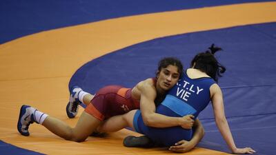 India’s Vinesh Phogat (in red) in a bout against Thi Ly Kieu of Vietnam during the Senior Asian Wrestling Championship in New Delhi in February 2020. (Vipin Kumar/HT File Photo) India’s Vinesh Phogat (in red) in a bout against Thi Ly Kieu of Vietnam during the Senior Asian Wrestling Championship in New Delhi in February 2020. (Vipin Kumar/HT File Photo)