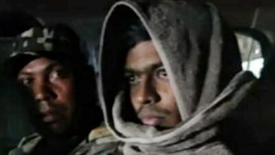 In this undated photo, Gangster Aman Sao in police custody. Sao was killed in an encounter when members of his gang tried to free him from police custody in Jharkhand's Palamu district, while being brought to Ranchi from Raipur jail, Tuesday. (PTI) In this undated photo, Gangster Aman Sao in police custody. Sao was killed in an encounter when members of his gang tried to free him from police custody in Jharkhand's Palamu district, while being brought to Ranchi from Raipur jail, Tuesday. (PTI)