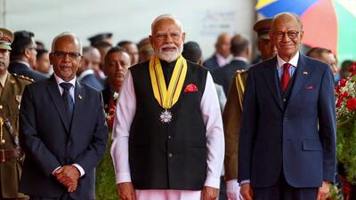 Prime Minister Narendra Modi (C) with his Mauritian counterpart Navin Ramgoolam (R) during national day celebrations of Mauritius in Port Louis. (AFP) Prime Minister Narendra Modi (C) with his Mauritian counterpart Navin Ramgoolam (R) during national day celebrations of Mauritius in Port Louis. (AFP)