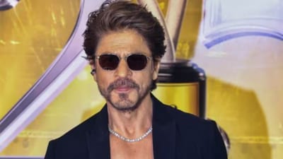 Shah Rukh Khan turned heads at IIFA 2025 in a sleek all-black ensemble, elevated by a dazzling diamond choker. Styled by Shaleena Nathani, his look exuded timeless elegance. (Instagram) Shah Rukh Khan turned heads at IIFA 2025 in a sleek all-black ensemble, elevated by a dazzling diamond choker. Styled by Shaleena Nathani, his look exuded timeless elegance. (Instagram)