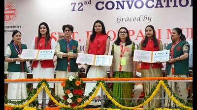 Students receiving degrees during the 72rd convocation ceremony at Panjab University's gymnasium hall on Wednesday. (Keshav Singh/HT)