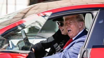 Elon Musk, chief executive officer of Tesla Inc., left, and US President Donald Trump in a Tesla Model S vehicle on the South Lawn of the White House in Washington, DC, US, on Tuesday, March 11, 2025. Photographer: Samuel Corum/Sipa/Bloomberg (Bloomberg) Elon Musk, chief executive officer of Tesla Inc., left, and US President Donald Trump in a Tesla Model S vehicle on the South Lawn of the White House in Washington, DC, US, on Tuesday, March 11, 2025. Photographer: Samuel Corum/Sipa/Bloomberg (Bloomberg)