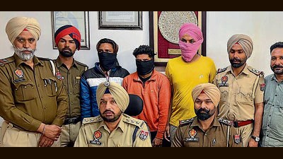The accused in custody of Ludhiana police on Wednesday. Cops say the petrol pump salesman was the mastermind behind the ₹6.8-lakh robbery. (HT Photo) The accused in custody of Ludhiana police on Wednesday. Cops say the petrol pump salesman was the mastermind behind the ₹6.8-lakh robbery. (HT Photo)