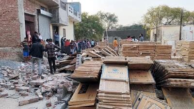 The eight-foot wall of a tile warehouse collapsed, burying them under debris on Tuesday evening. (Sakib Ali/HT Photo) The eight-foot wall of a tile warehouse collapsed, burying them under debris on Tuesday evening. (Sakib Ali/HT Photo)