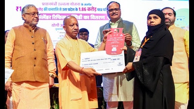 UP chief minister Yogi Adityanath with deputy chief minister Brajesh Pathak during the distribution of LPG cylinder refill subsidy to beneficiaries under the 'Pradhan Mantri Ujjwala Yojana', in Lucknow. (PTI) UP chief minister Yogi Adityanath with deputy chief minister Brajesh Pathak during the distribution of LPG cylinder refill subsidy to beneficiaries under the 'Pradhan Mantri Ujjwala Yojana', in Lucknow. (PTI)
