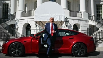 Donald Trump exits the Tesla vehicle after sitting in it on the South Portico of the White House to talk to the press on March 11, 2025 in Washington, DC. (Mandel NGAN / AFP)