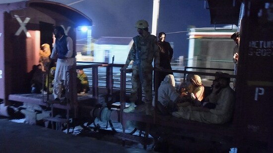 A soldier works to evacuate freed train passengers at the Mach railway station, which has been turned into a makeshift hospital, after Pakistani security forces freed nearly 104 passengers following a security operation against armed militants who ambushed the train in the remote mountainous area, in Mach, southwestern Balochistan province on March 11, 2025. (AFP)