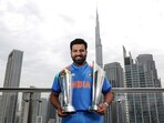 India's captain Rohit Sharma poses for a picture with the ICC Champions Trophy 2025 and T20 World Cup 2024 trophy, in Dubai