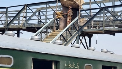 A paramilitary soldier stands guard at a railway station in the Sibi district of southwestern Balochistan province during a security operation against militants a day after they hijacked a passenger train. (AFP) A paramilitary soldier stands guard at a railway station in the Sibi district of southwestern Balochistan province during a security operation against militants a day after they hijacked a passenger train. (AFP)