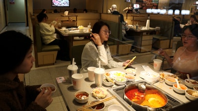 FILE PHOTO: Customers dine at the Hailao Huoguo, a new hotpot chain by Haidilao, in Beijing, China. (REUTERS)