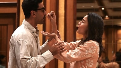 The couple fed each other cake as the media clicked their pictures. (AFP) The couple fed each other cake as the media clicked their pictures. (AFP)