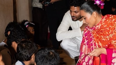 Kim Kardashian serving food to children with Jay Shetty during her visit to India last year. Kim Kardashian serving food to children with Jay Shetty during her visit to India last year.